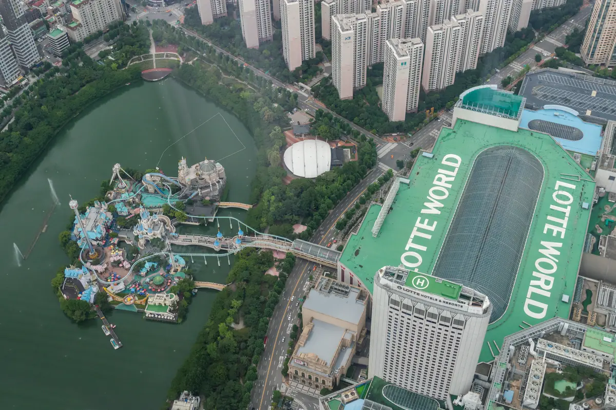 A view from Lotte World Tower over Seokchon Lake and Lotte World's Magic Island castle on the lake