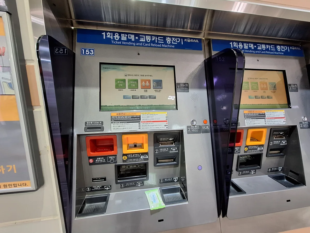Ticket and transit-card top-up machines inside a capital-region subway station