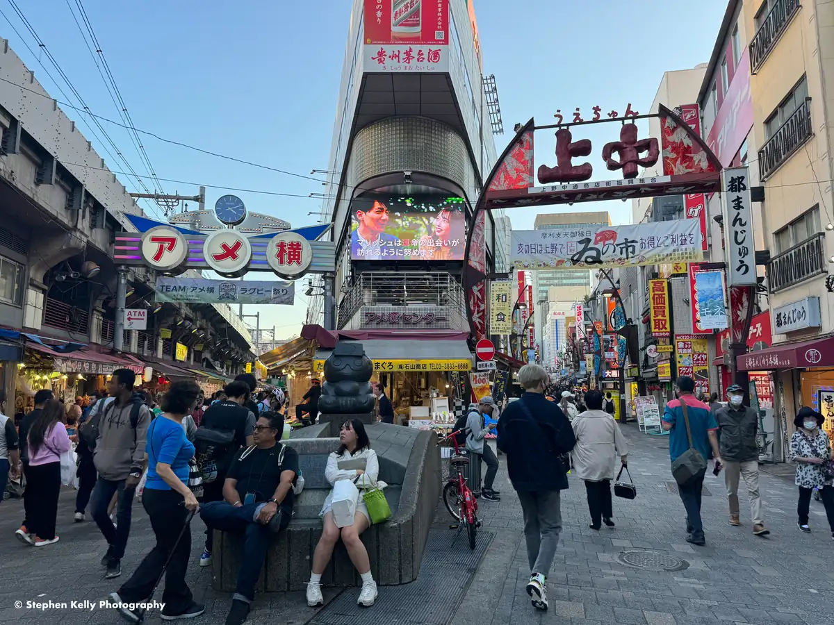 Ameyoko shopping street in Ueno, with shops on both sides and shoppers walking through